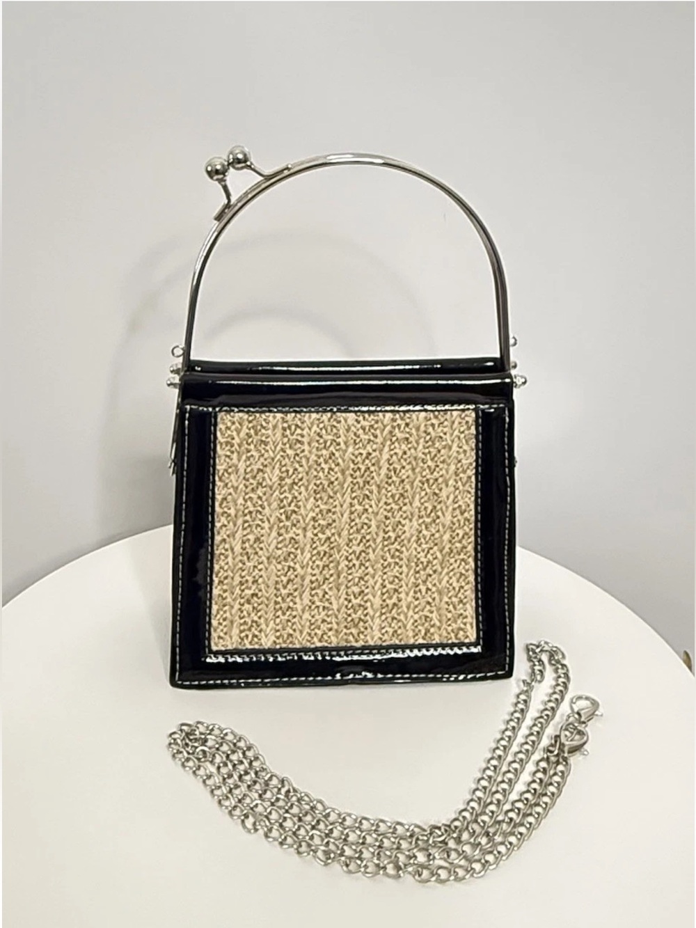 Kisslock Frame Handle Bag Patent Leather with Woven Accent.